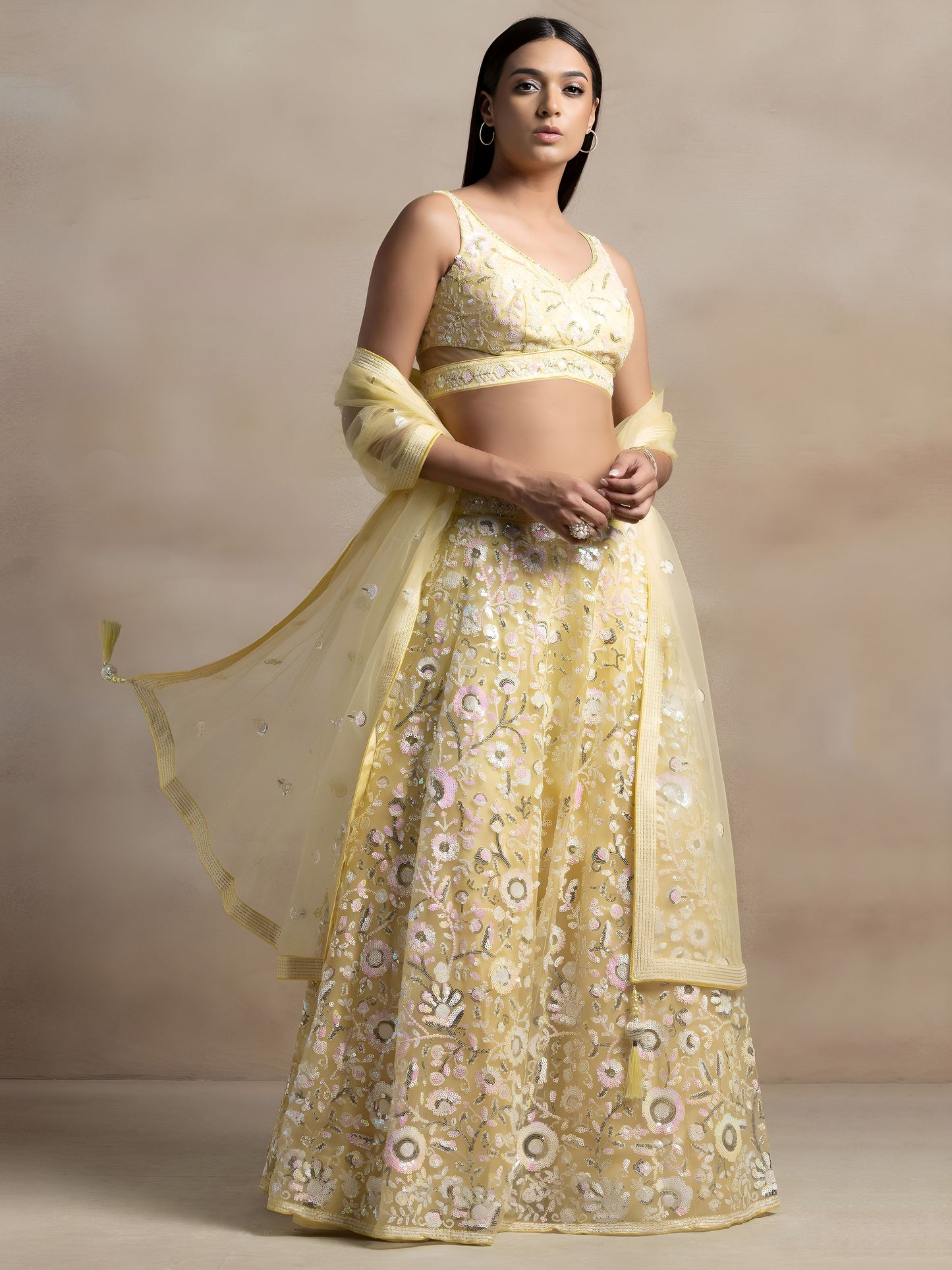 Kyraja Yellow Soft Net Embroidered Lehenga Choli